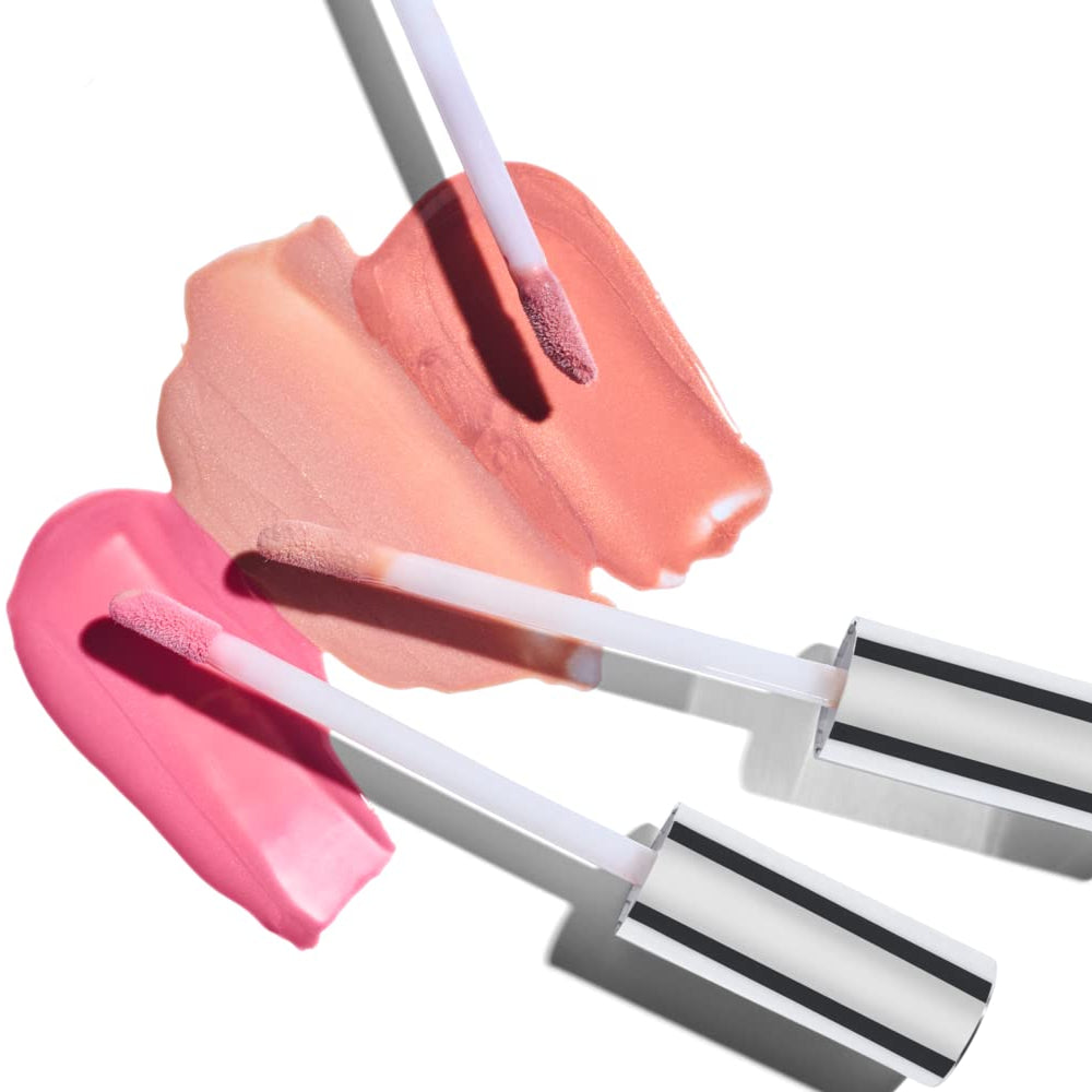 Colorescience Lip Shine applicators displaying lip gloss color swatches during application process