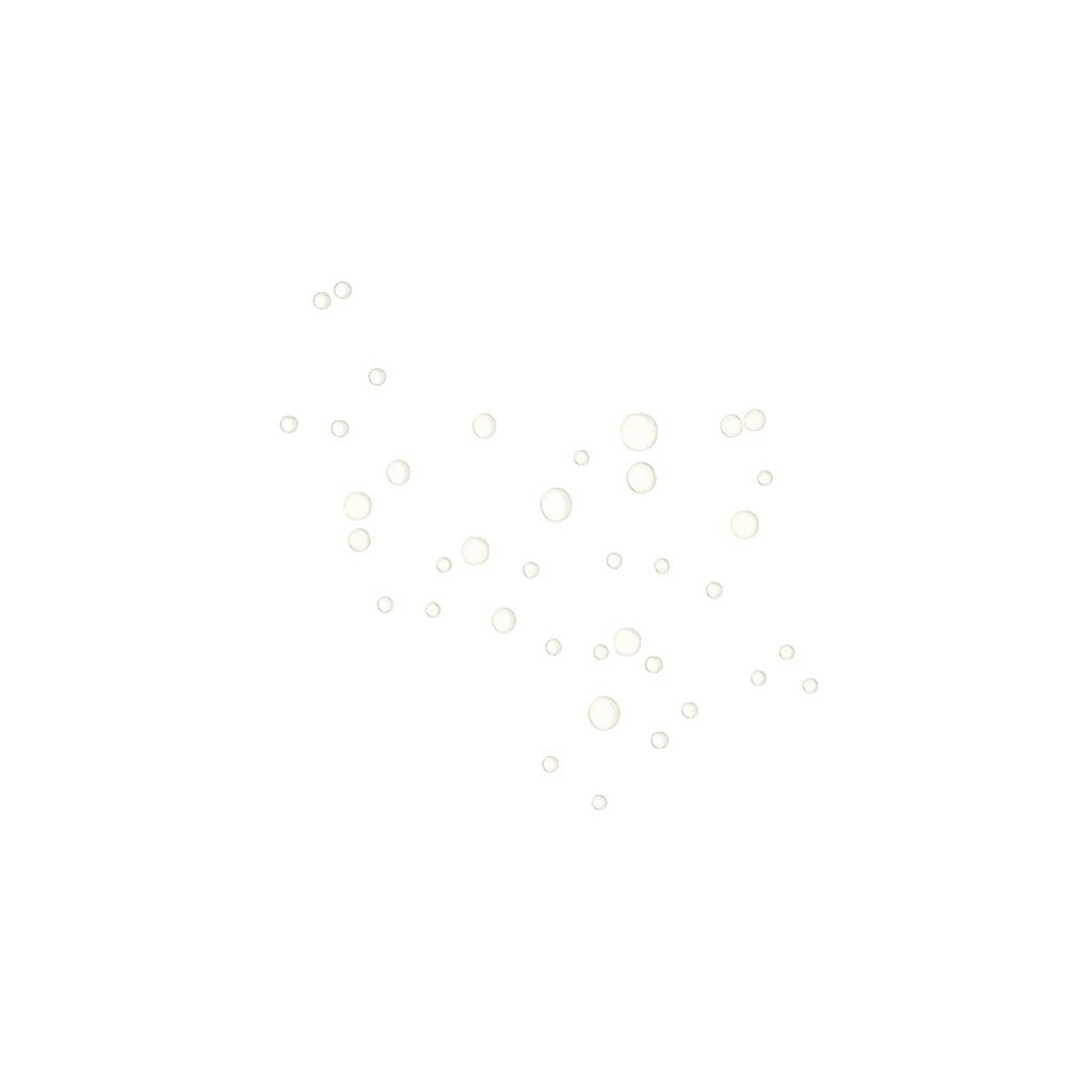 Droplets of One Love Organics Gardenia and Tea Body Serum once sprayed