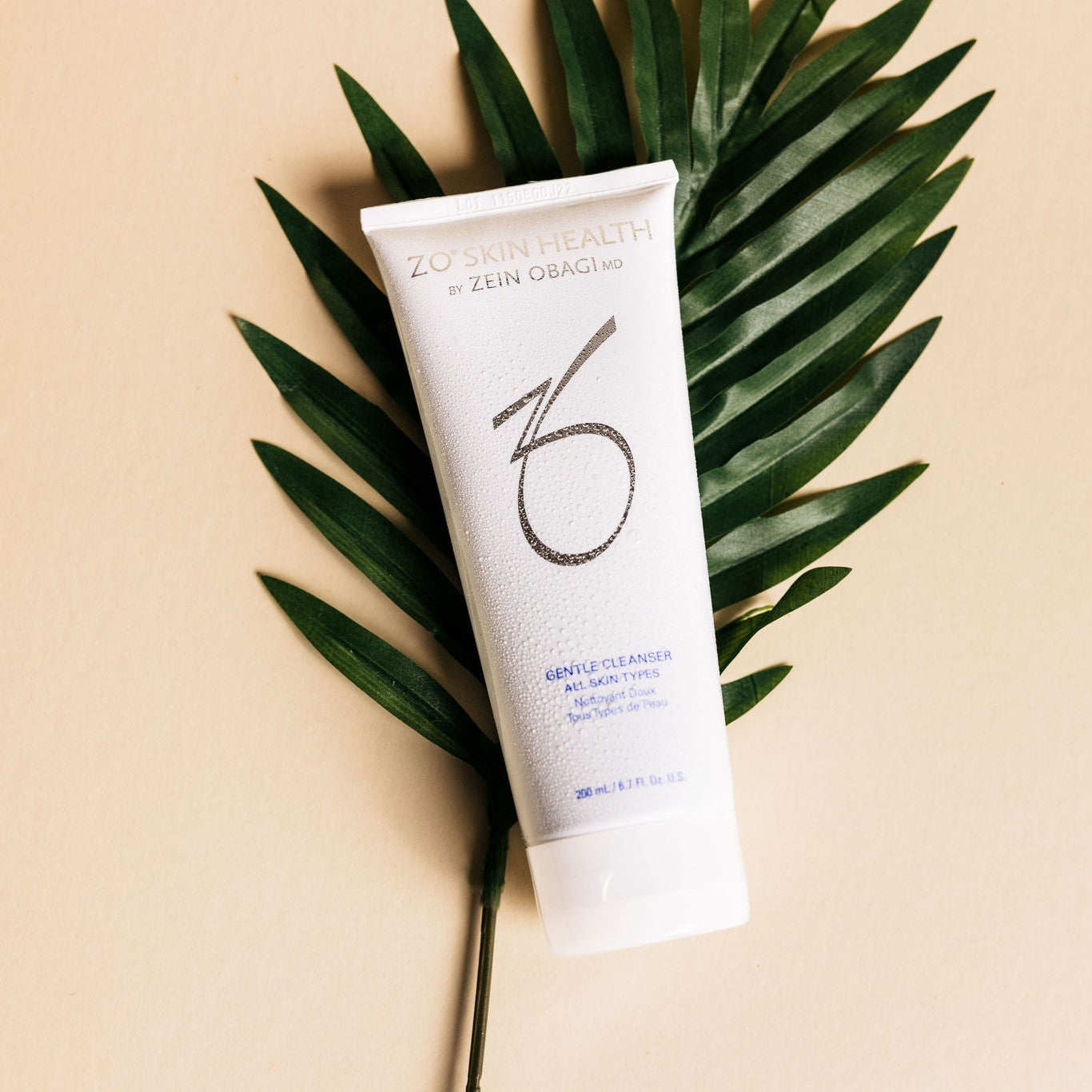 ZO Skin Health Gentle Cleanser on palm leaf background