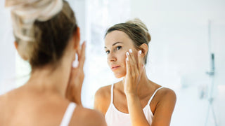 A woman applying Tretinoin to prepare for a Chemical Peel