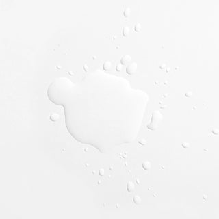 Droplets of AlumierMD Bright and Clear Solution once dispensed
