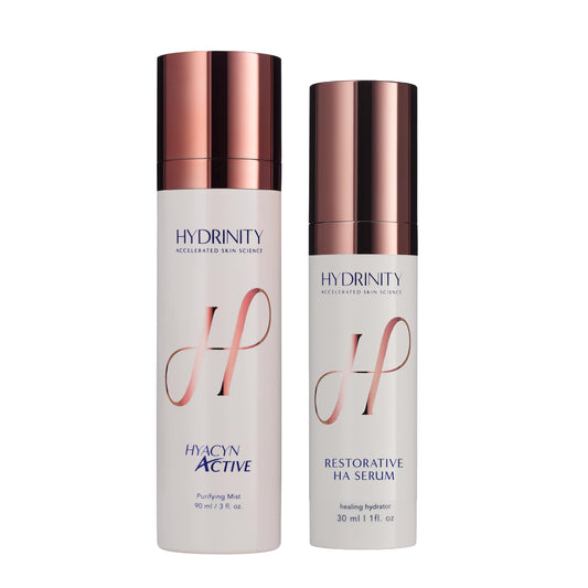 Hydrinity Hyacyn Active Mist and Restorative HA Serum bottles side by side